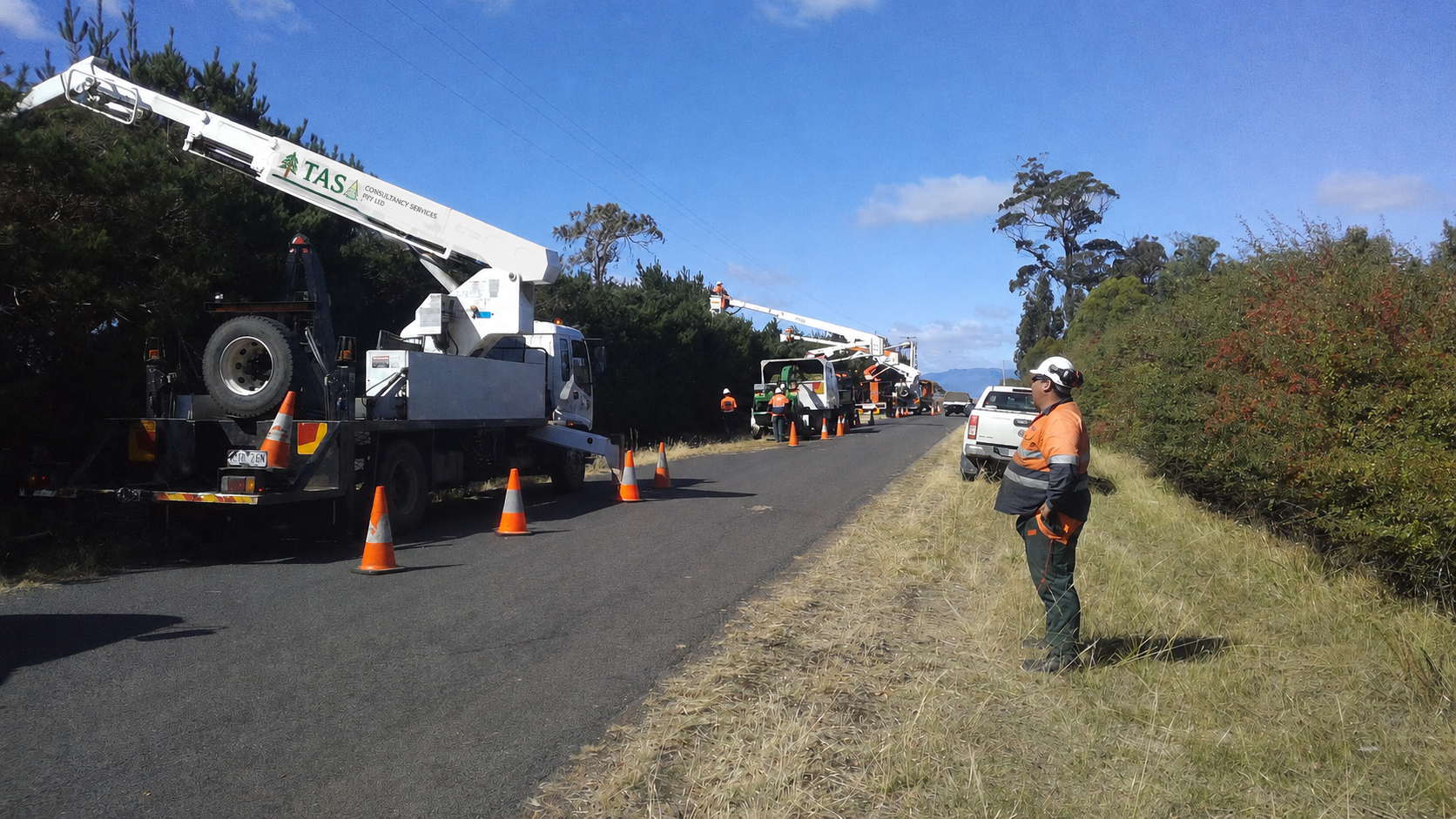 Traffic management crew with elevated work platforms on a rural Tasmanian road